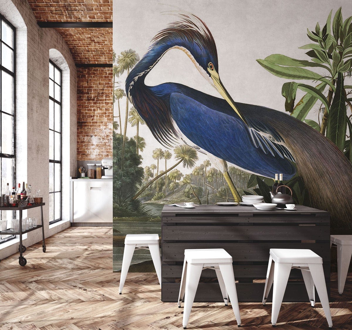 Elegant Blue Heron mural wallpaper in modern kitchen; brick wall, dark table, white stools, wood flooring.