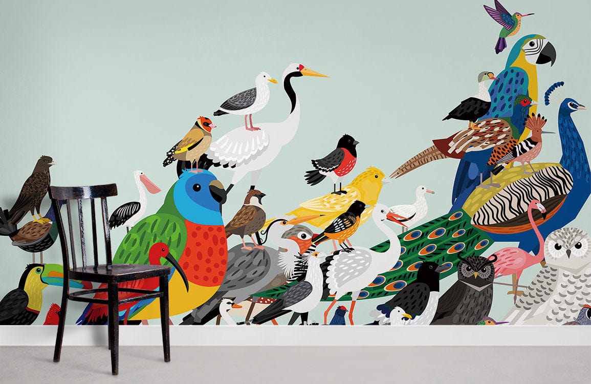Vibrant multicoloured tropical birds mural wallpaper, nature-inspired design in a room with a black chair.
