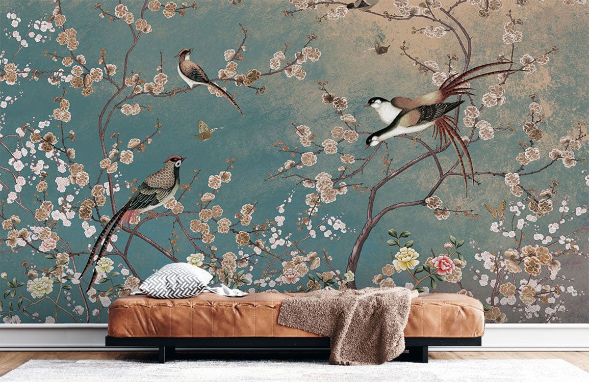 Chinoiserie mural wallpaper with teal gold bird pattern, brown leather couch, white rug, wooden floor.