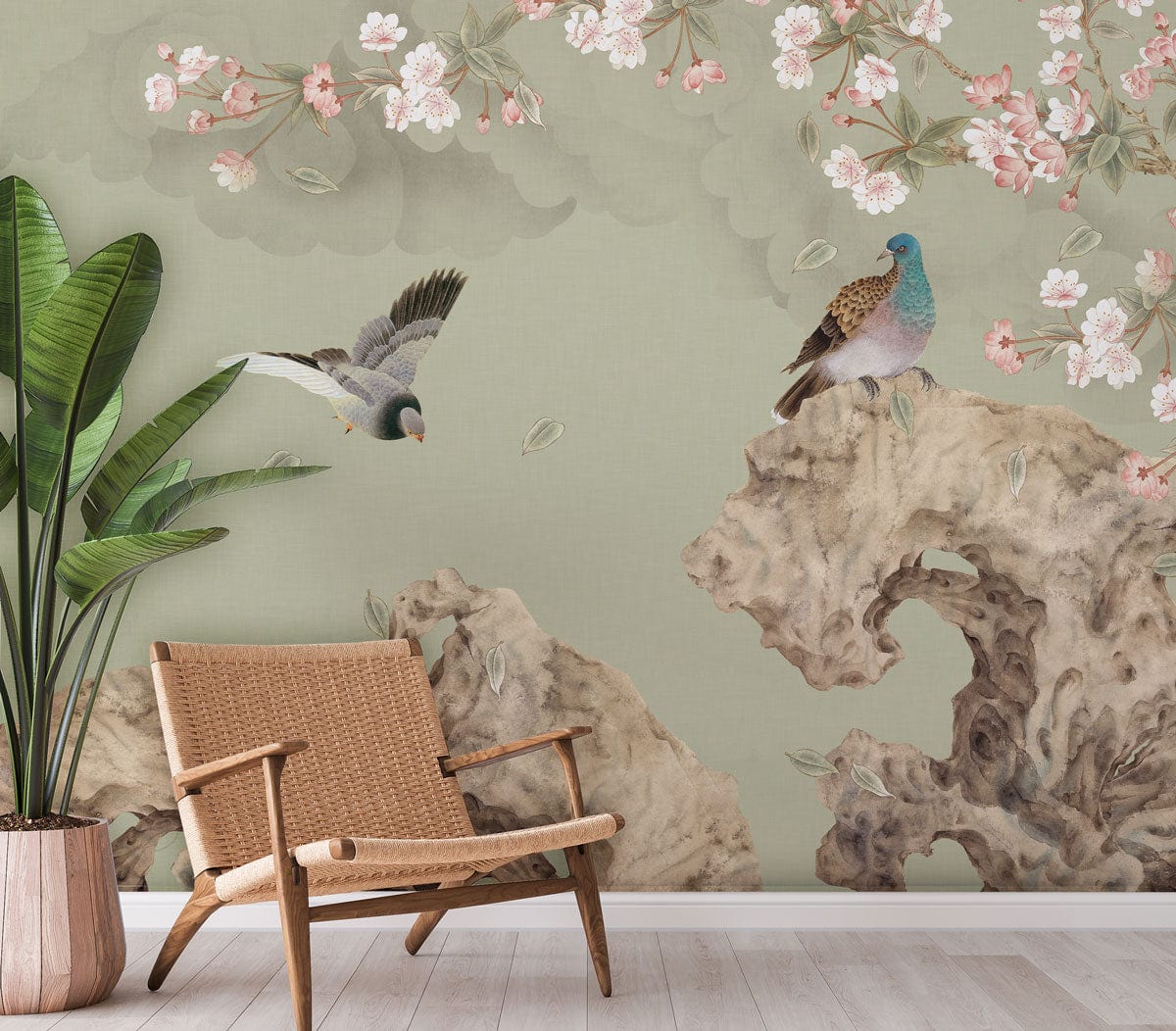 Serene Pastels mural with birds, cherry blossoms, wicker chair, light wood flooring in living room.