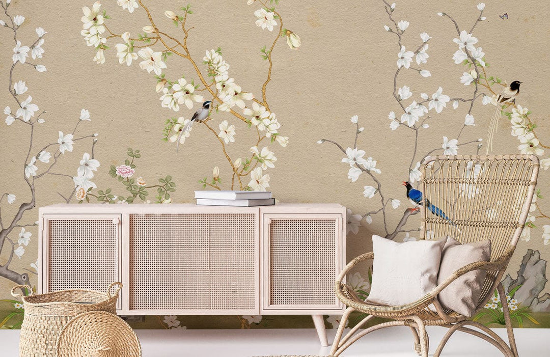 Elegant Vintage Floral Birds Beige Mural Wallpaper in living room with rattan chair, beige console.