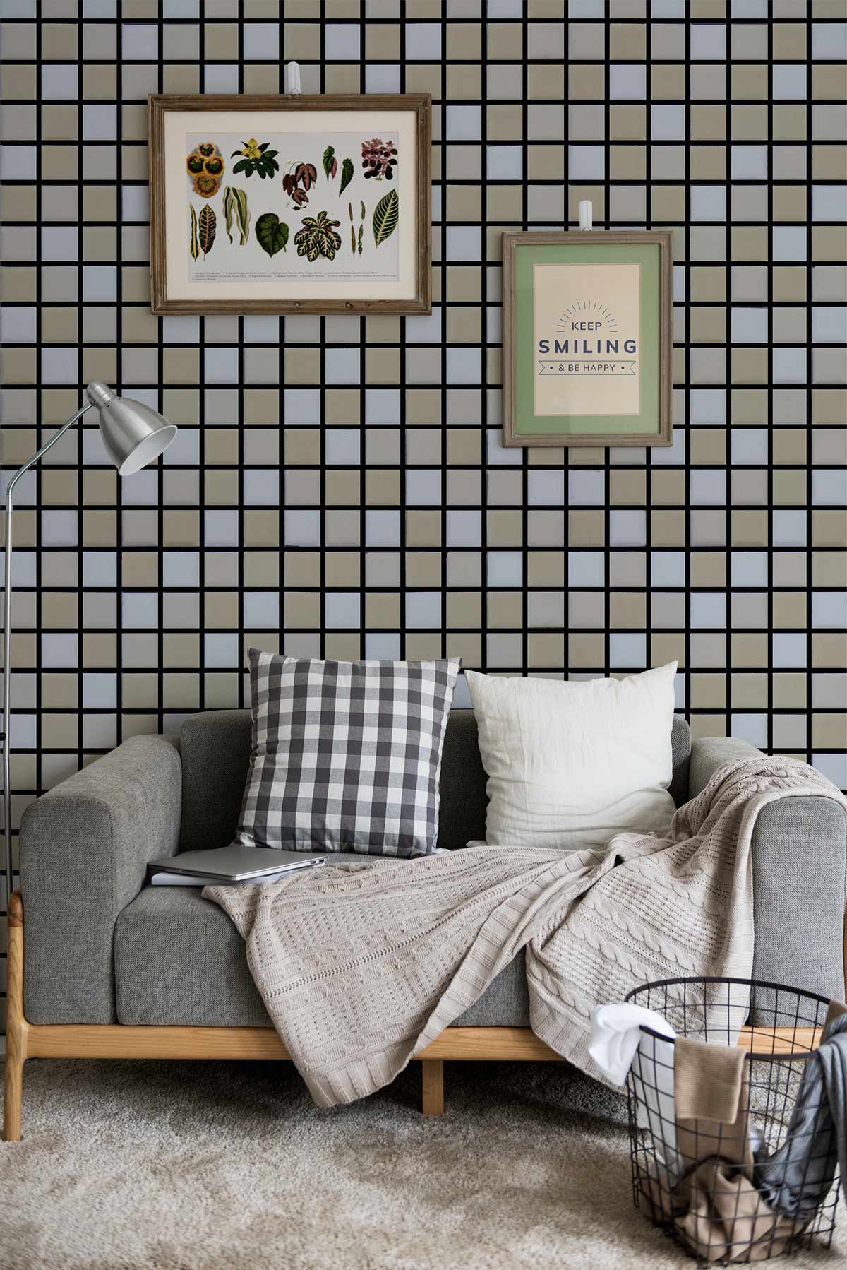Contemporary grey sofa, geometric grid wallpaper, shaker-style floor lamp, framed art in living room.