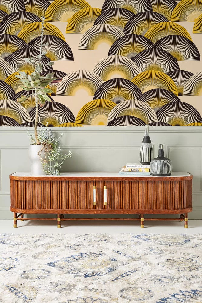 Art Deco Fan Pattern Wallpaper features yellow, black fans; elegant wooden sideboard; patterned carpet flooring.