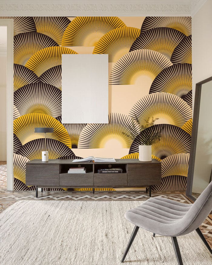 Art Deco fan pattern wallpaper in living room with grey chair, geometric flooring, and minimalist sideboard.