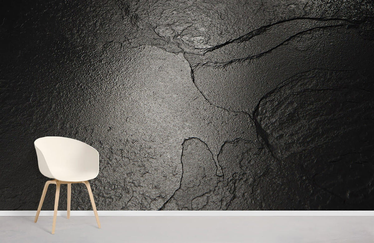 Charcoal textured slate wallpaper, modern industrial design, white chair, light wood legs, contemporary room.