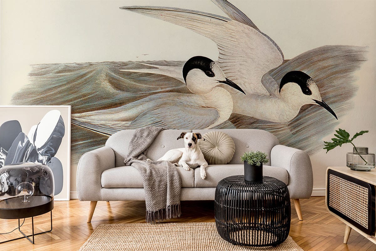 Elegant coastal seabird mural wallpaper, grey sofa, parquet flooring, chic black coffee table, contemporary decor.
