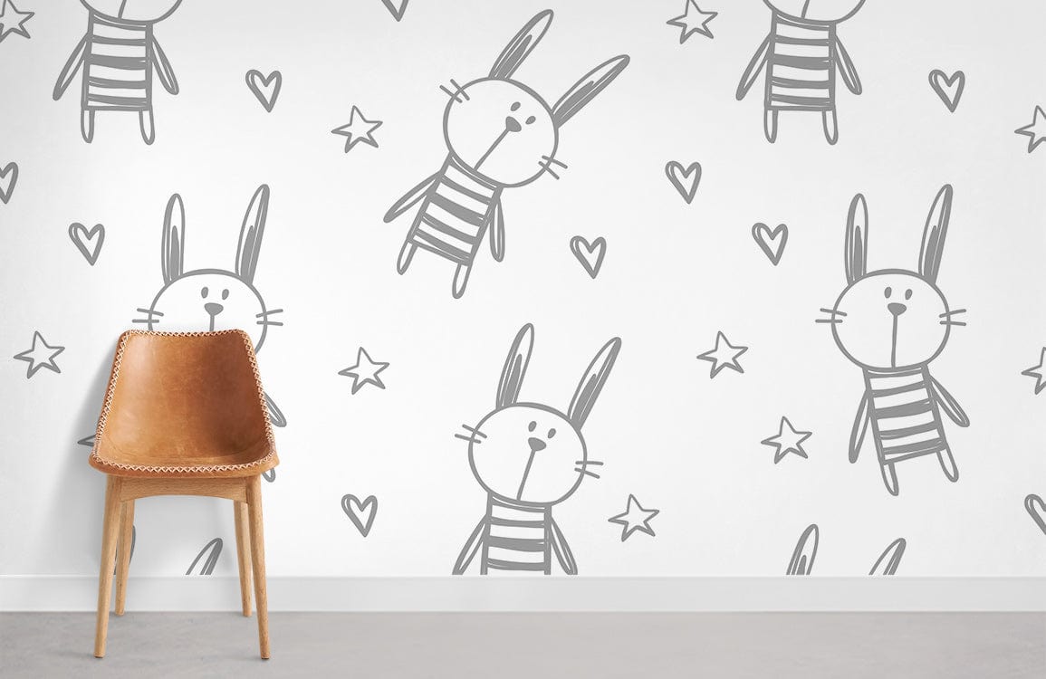 Cute grey bunny and star children's wallpaper in nursery with brown chair, grey flooring.