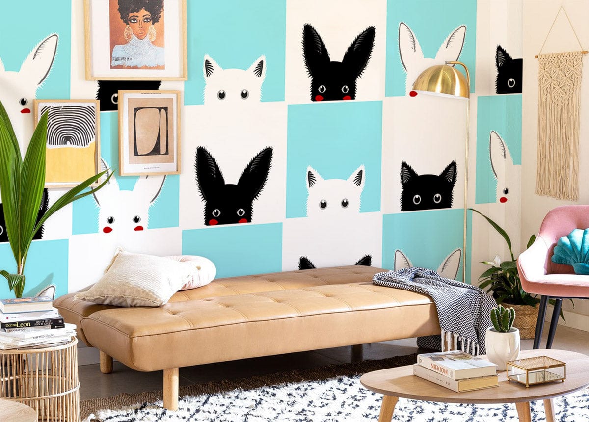 Playful monochrome aqua bunny wallpaper in modern living room with tan daybed and pink chair.