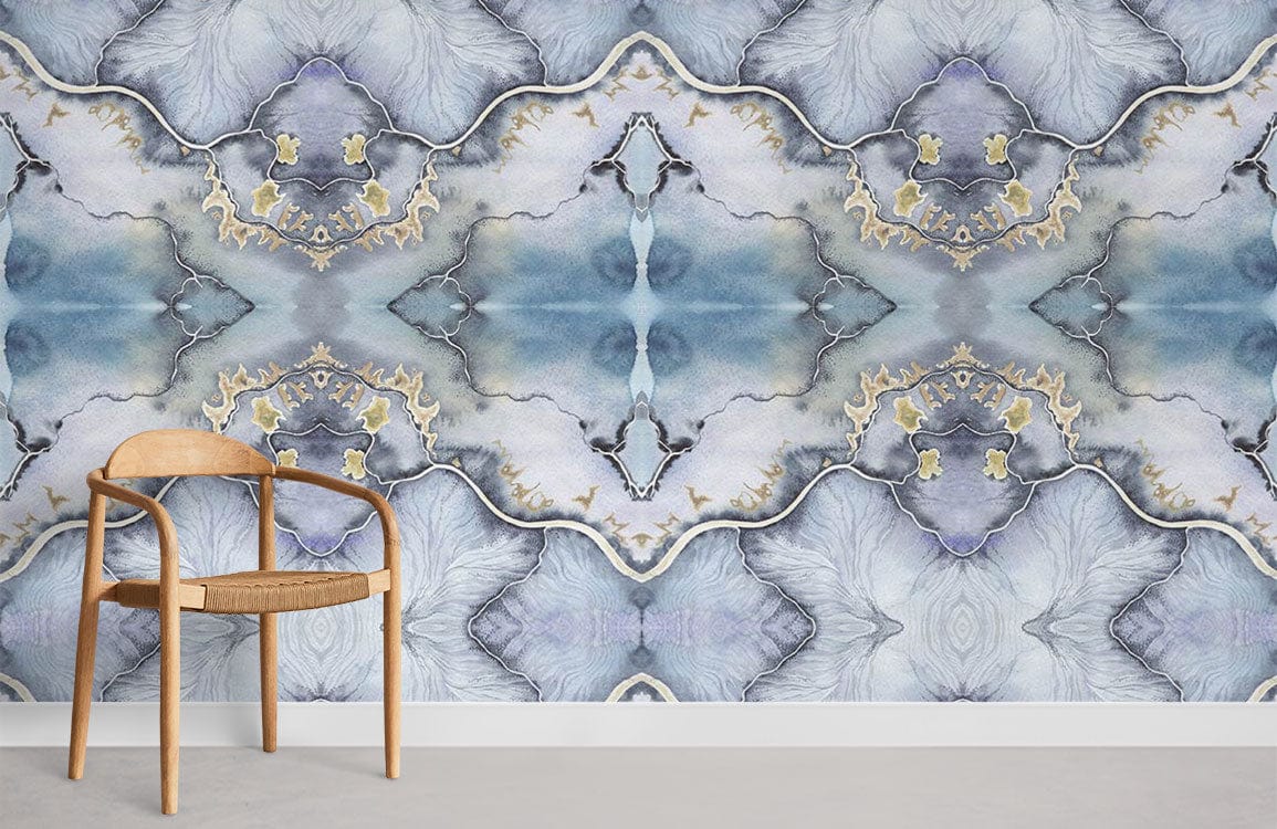 Elegant blue-grey mural wallpaper, gold accents, wooden chair, abstract patterned wall, modern room design.