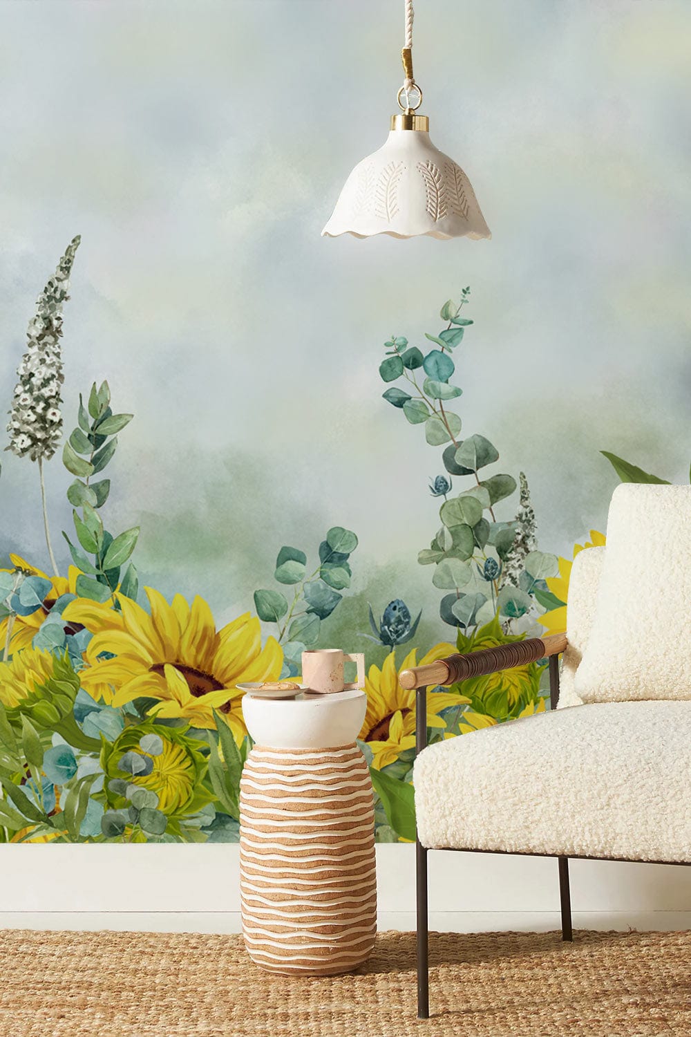 Sunflower Bliss wallpaper with armchair, rattan flooring, pendant light, and serene mural in living room.