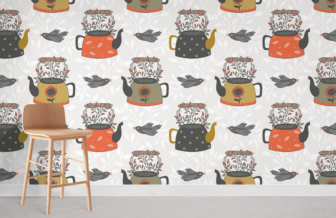 Vintage teapot and bird pattern wallpaper in earthy tones, room setting with wooden chair, light floor.