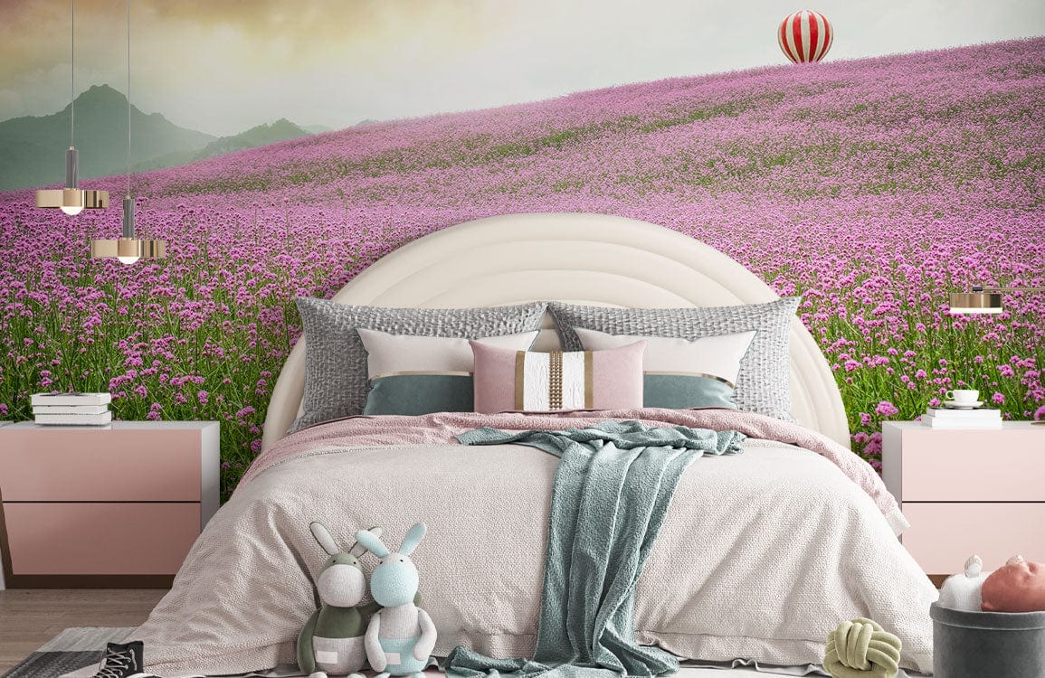 Lavender field wallpaper featuring hot air balloon; pastel bedroom decor with cream bed and pink accent.