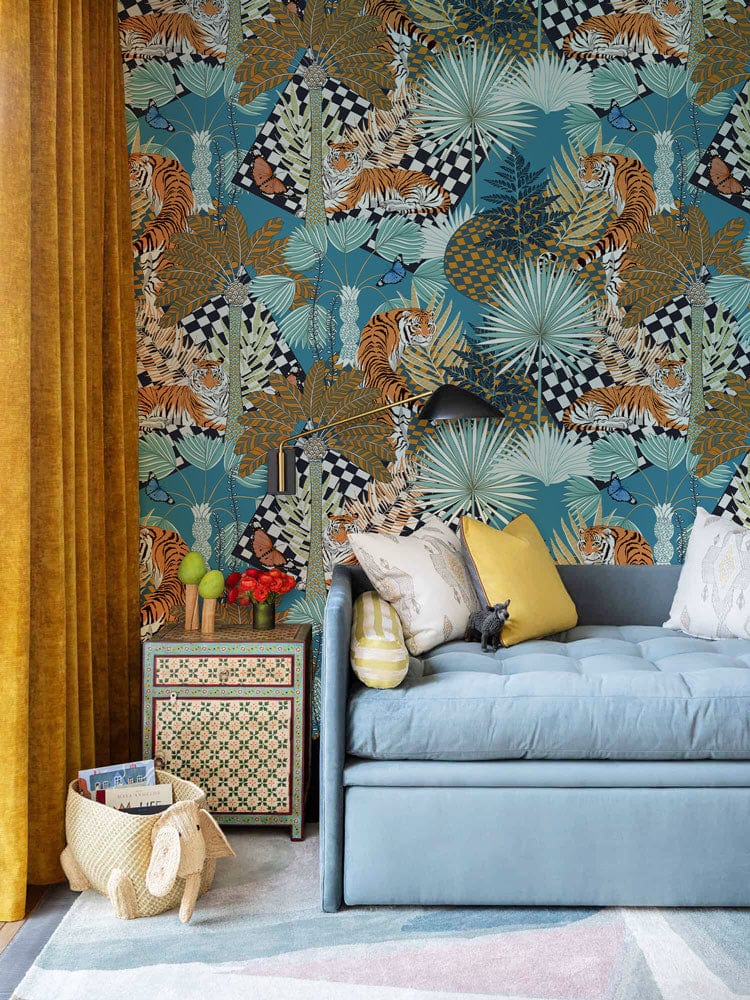 Exotic Jungle Safari Wallpaper with Tigers, blue sofa, mustard curtains, colourful rug in living room.
