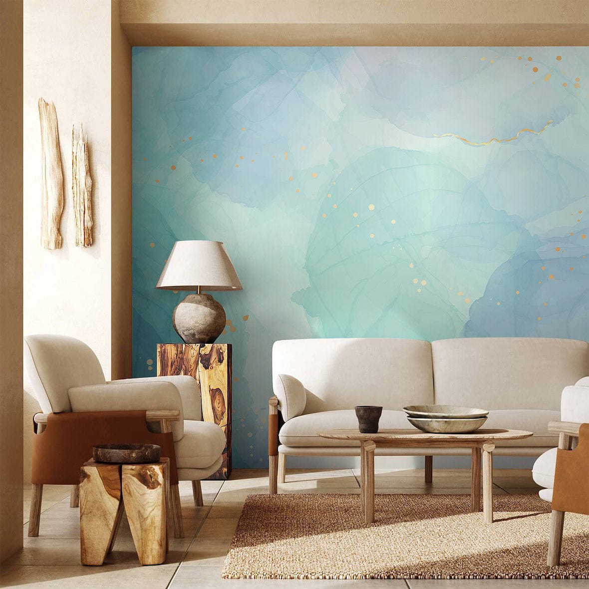 Elegant watercolour pastel blue abstract gold splatter mural with beige sofas and wood-textured table.
