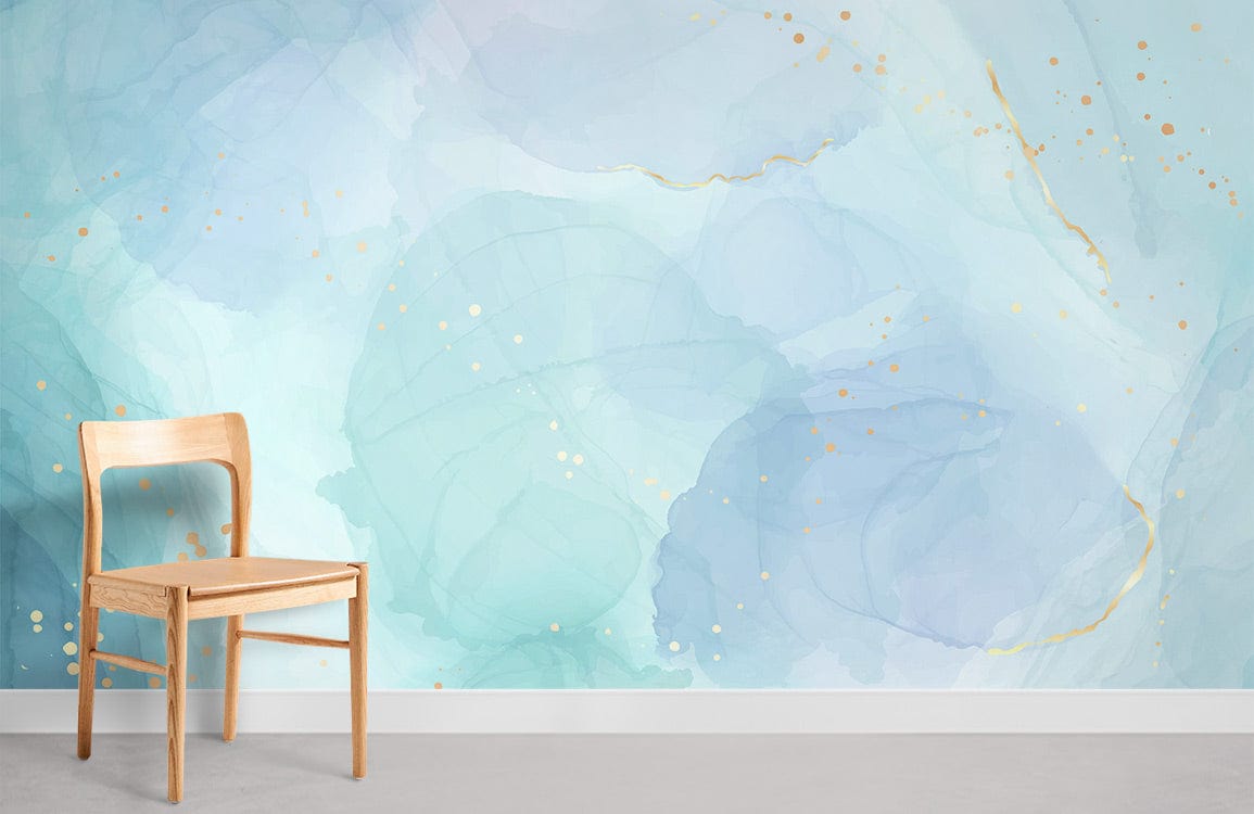 Elegant Watercolour Pastel Blue Abstract Gold Splatter Mural Wallpaper Décor with wooden chair.