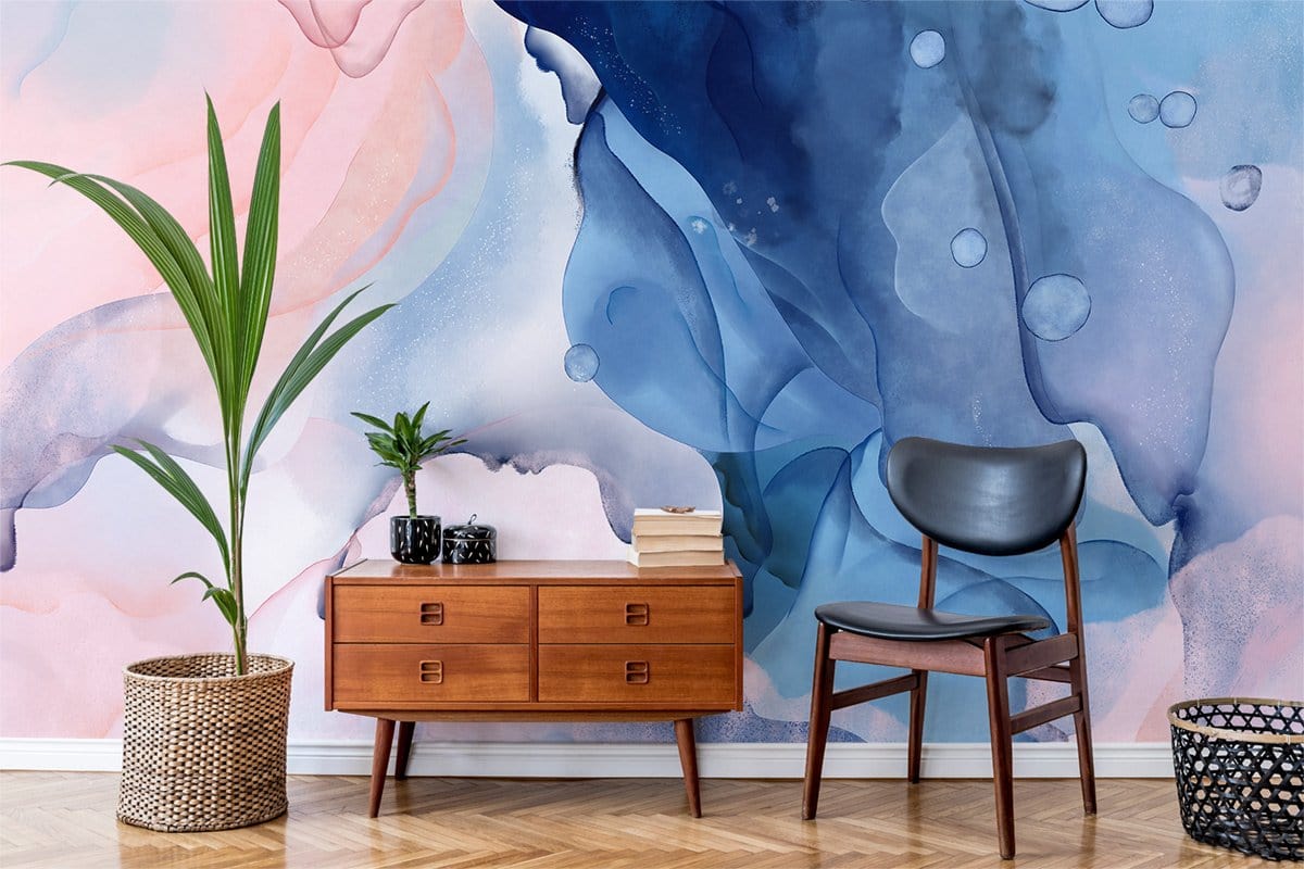 Elegant watercolour swirl mural wallpaper, pastel hues, wooden console, black chair, parquet flooring, indoor plant.