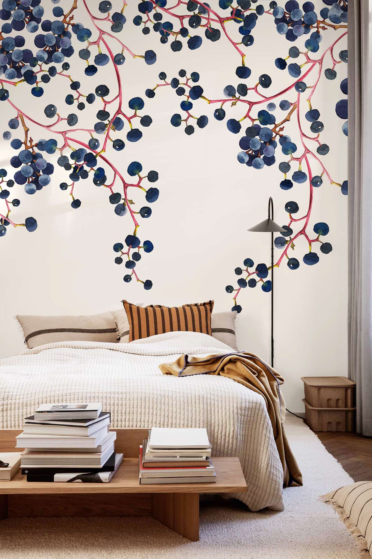 Elegant Blueberry Vine Watercolour Mural Wallpaper in bedroom with modern bed, floor lamp, and wood accents.