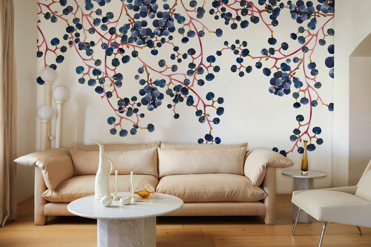 Elegant Blueberry Vine Watercolour Mural in modern lounge with cream sofa, wooden flooring, marble table.