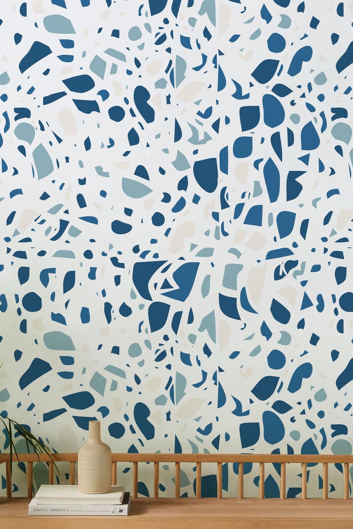 Modern blue and white terrazzo wallpaper, stylish interior, wooden bench, minimalist design, chic decor.