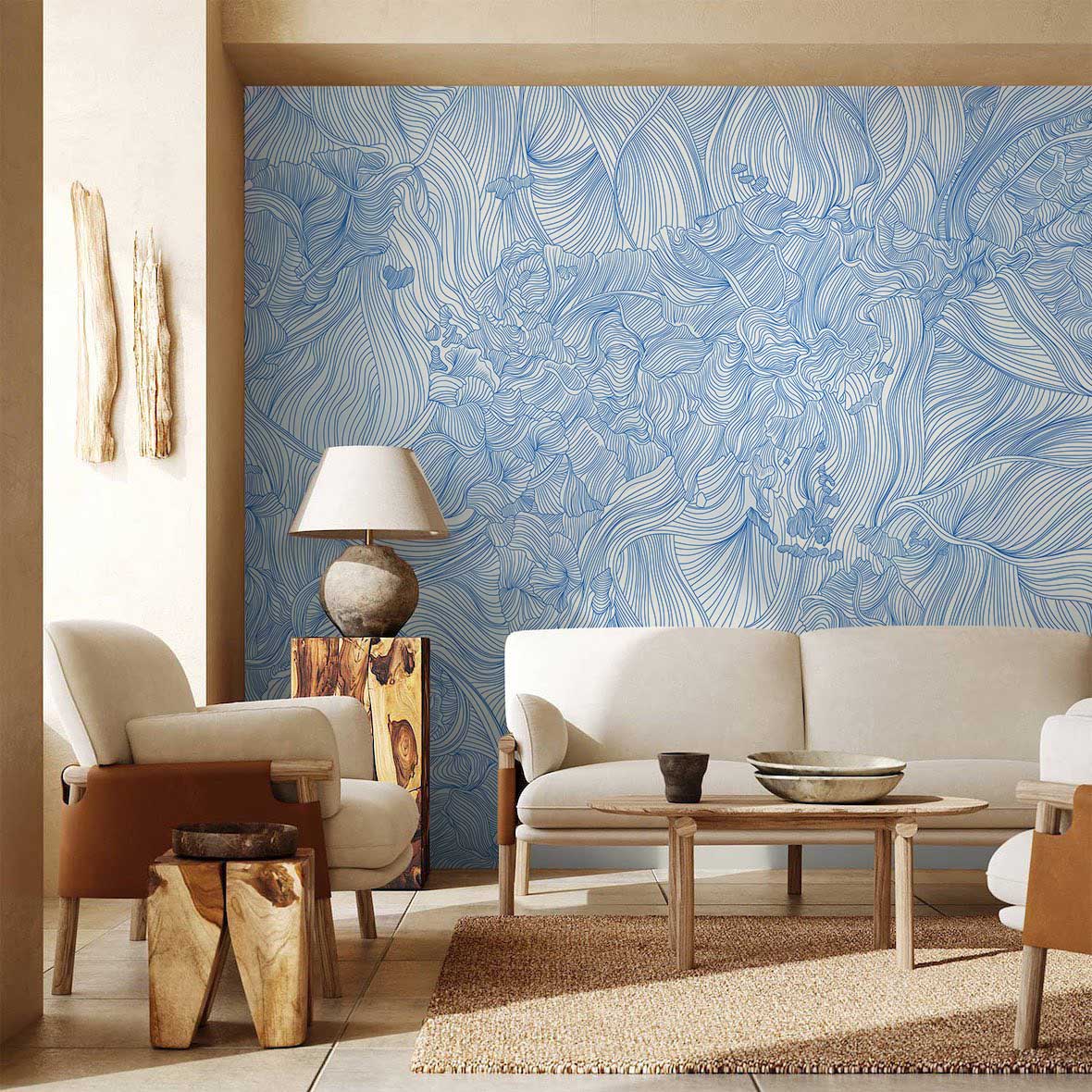 Elegant blue floral line art wallpaper in modern living room with beige sofa, wood tables, floor lamp.