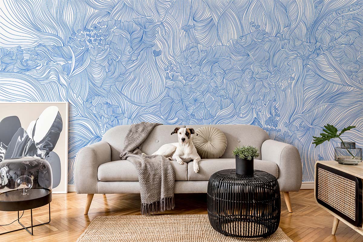 Elegant blue floral line art wallpaper with grey sofa, parquet flooring, and modern living room decor.