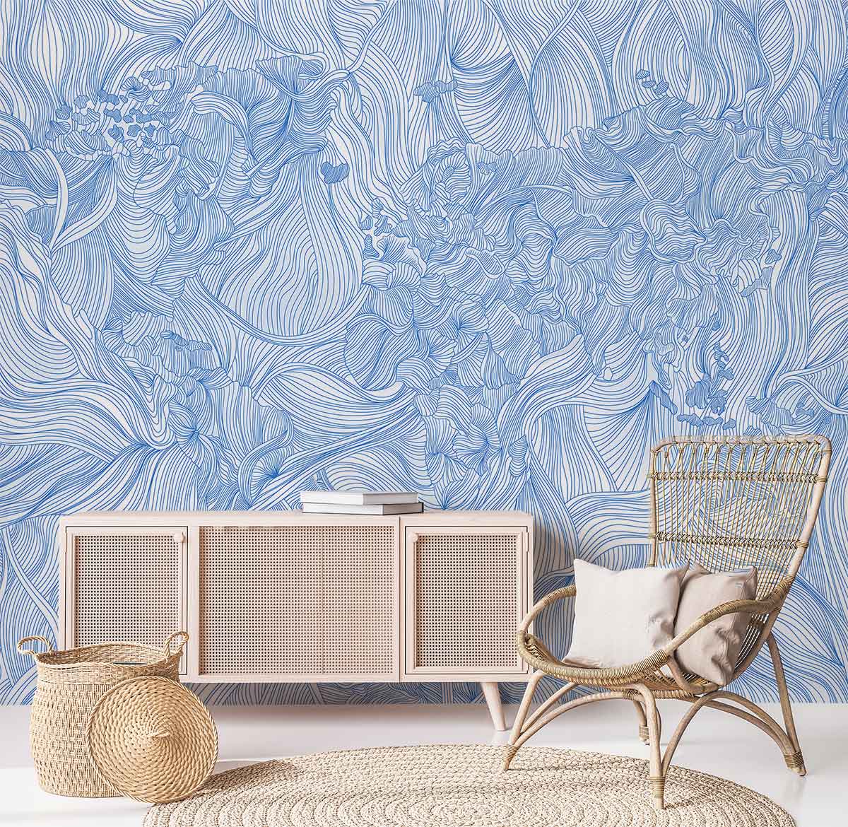 Elegant Blue Floral Wallpaper, modern botanical design; woven chair, light wood sideboard, neutral rug, basket.