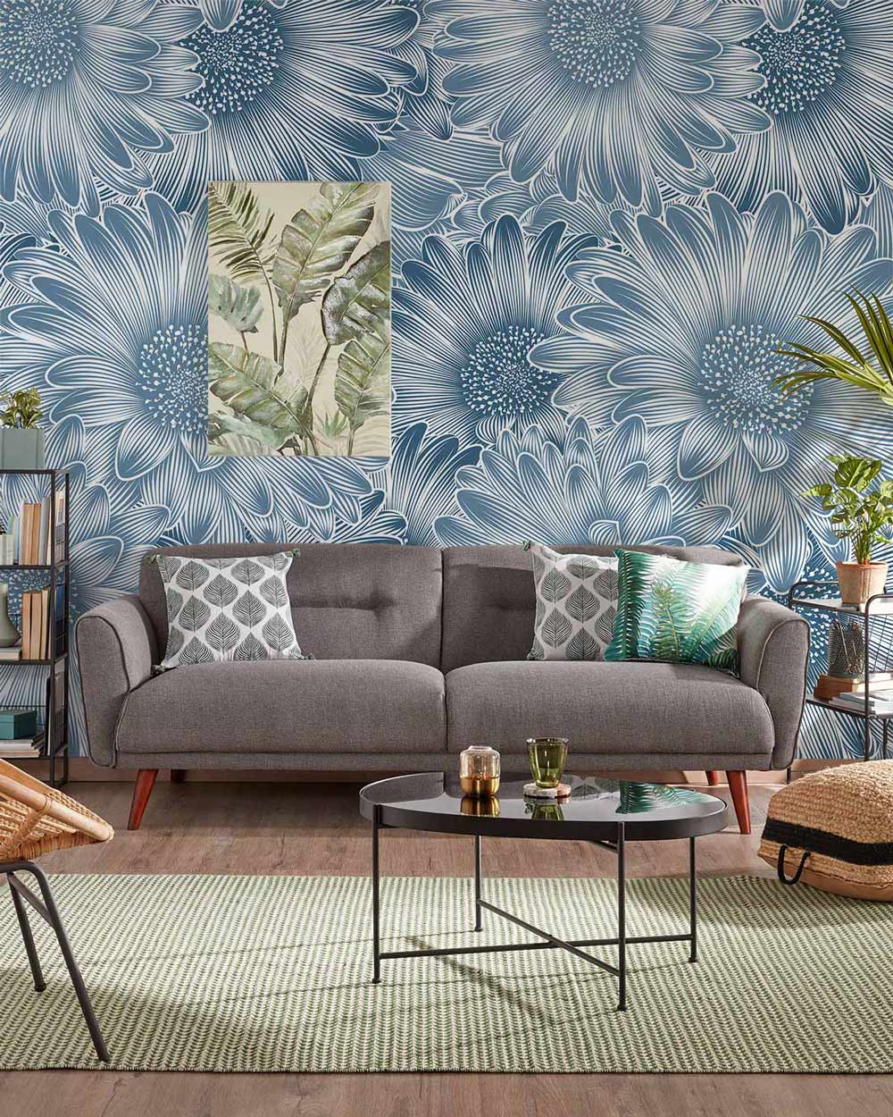 Elegant Blue Floral Pattern Wallpaper in living room with grey sofa, round table, and textured rug.
