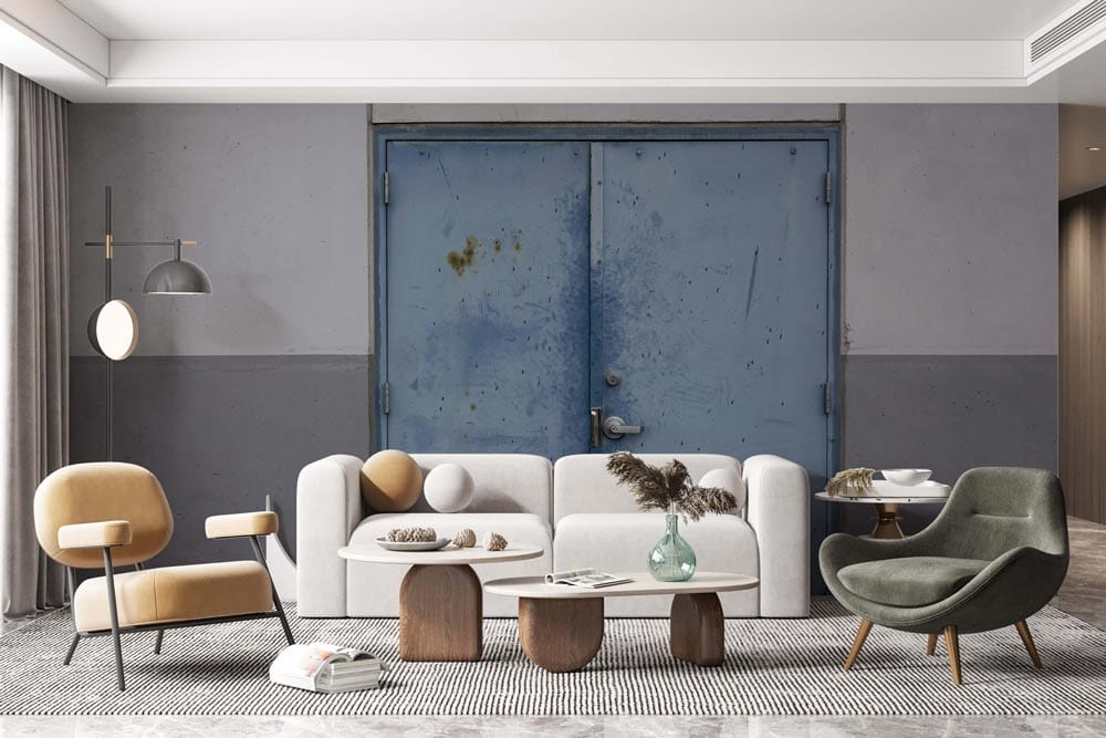 Industrial Chic cement effect wallpaper mural with grey-blue door, mid-century sofa, and modern armchairs.
