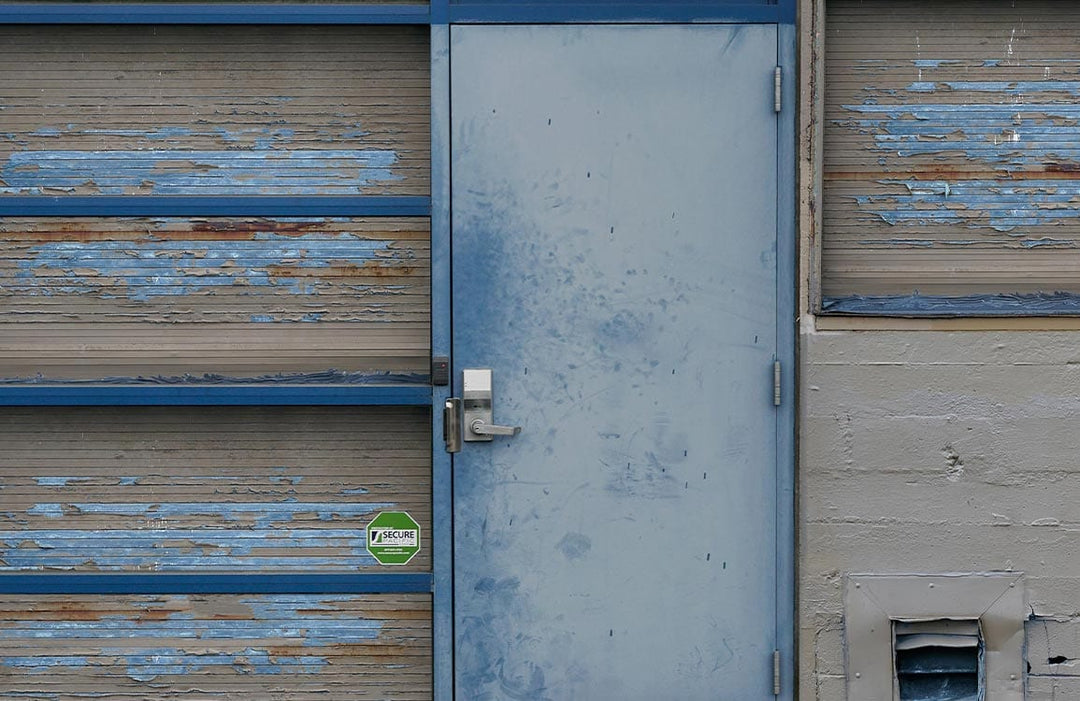 Vintage Industrial Blue Weathered Door Mural Wallpaper for Urban Spaces