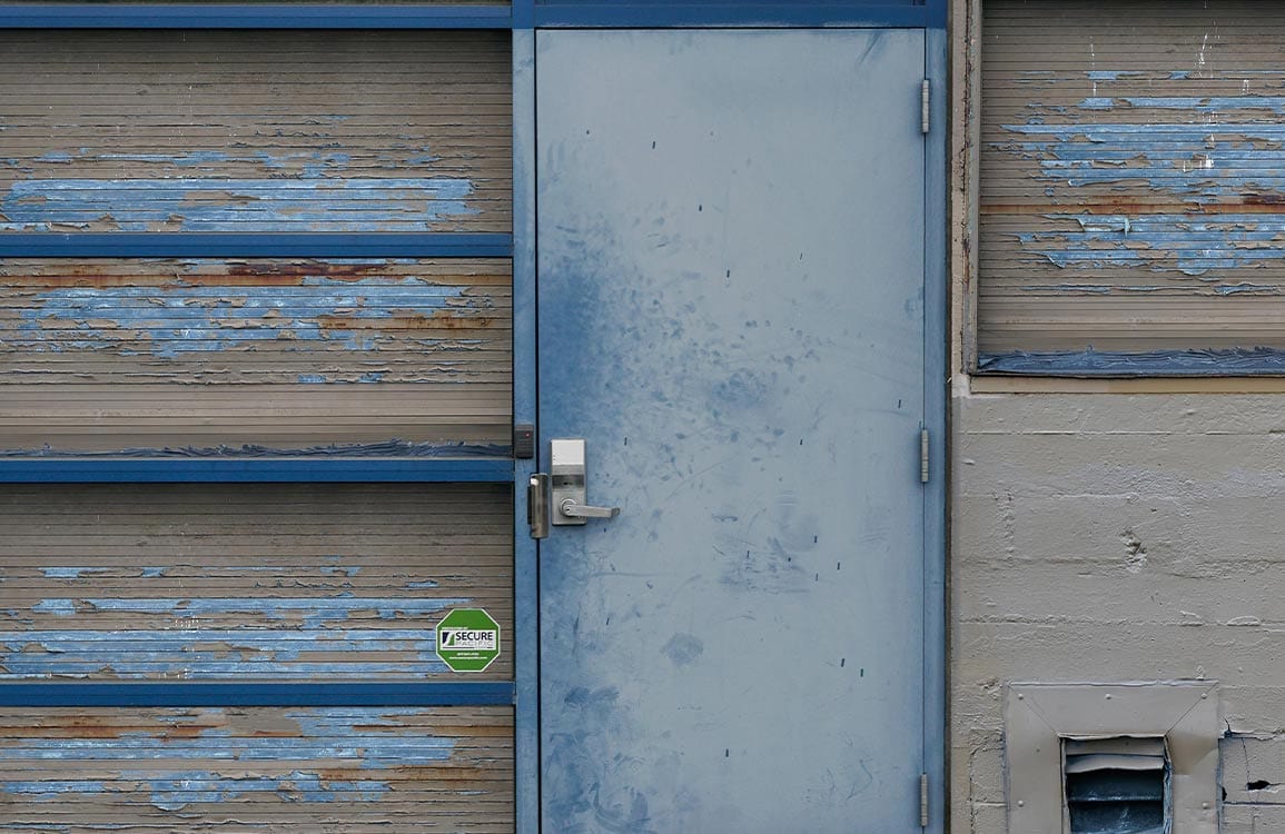 Vintage Industrial Blue Weathered Door Mural Wallpaper for Urban Spaces