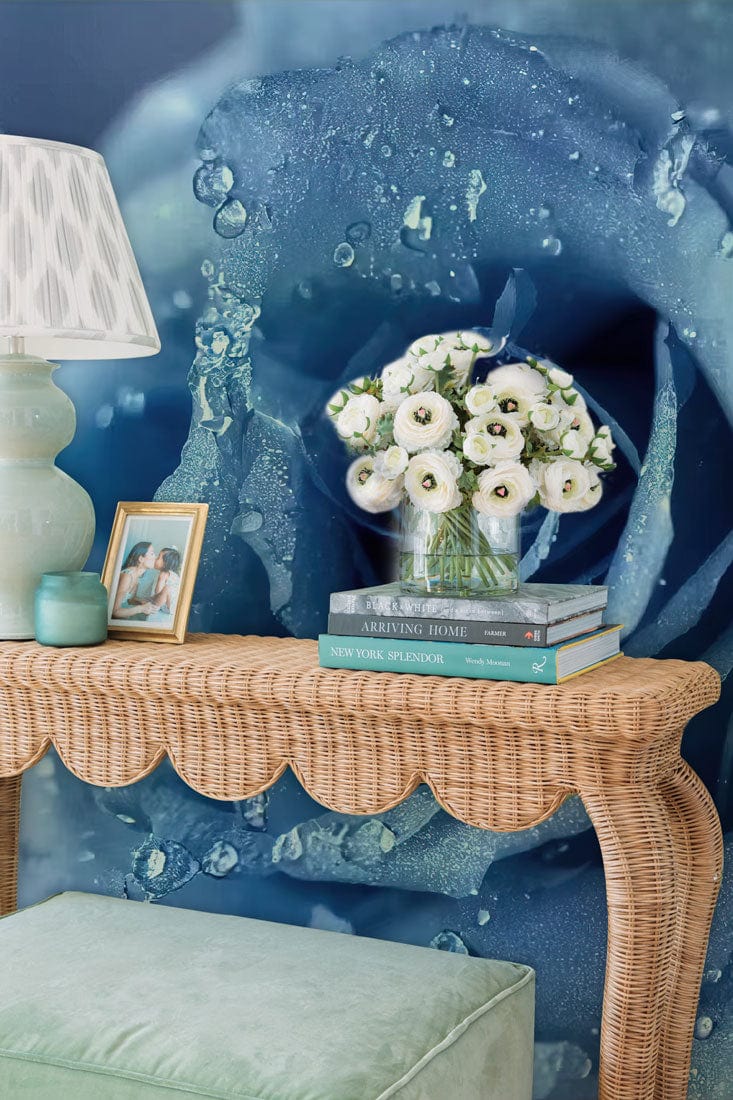 Elegant Blue Rose Mural Wallpaper with droplets illusion, wicker table, green cushion, ambient lamp.