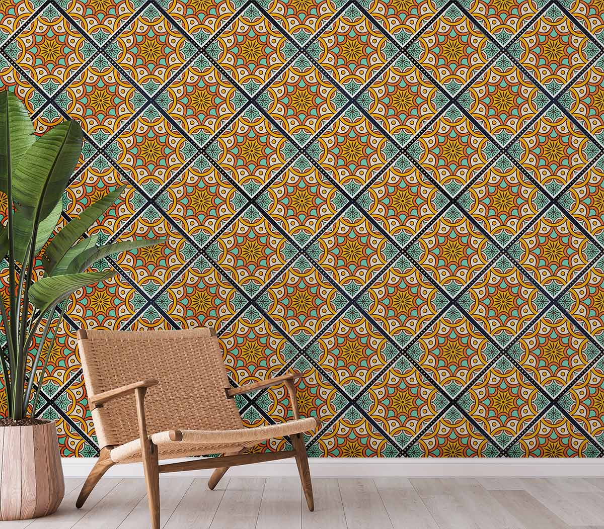 Geometric Moroccan tile wallpaper, vibrant orange and blue, wicker chair, light wood flooring, potted plant.