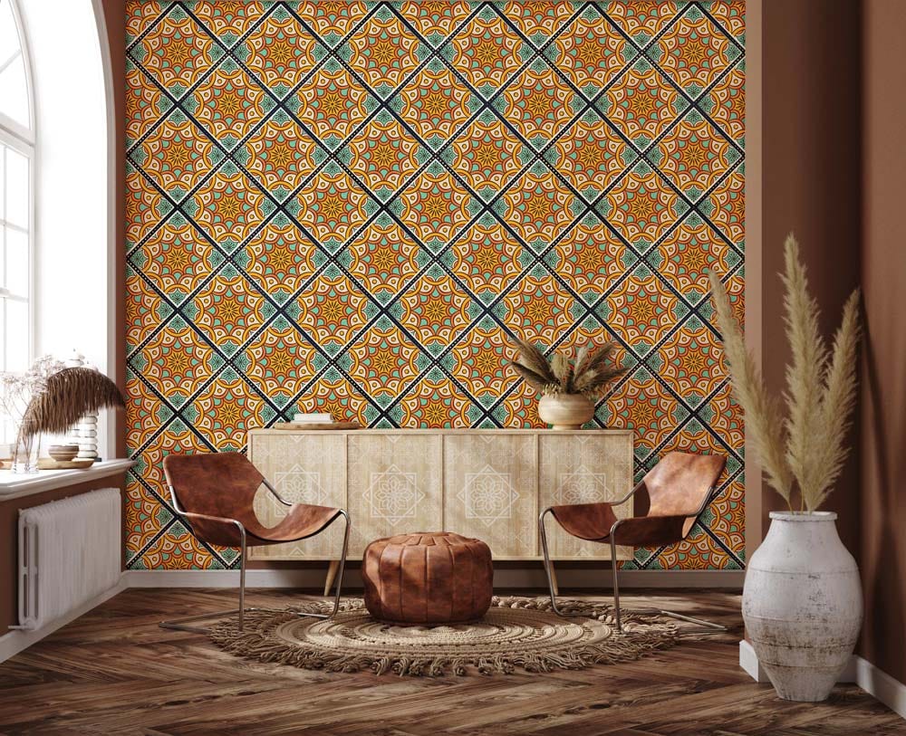 Geometric Moroccan Tile Wallpaper in vibrant orange and blue, wooden flooring, leather chairs, and sideboard.