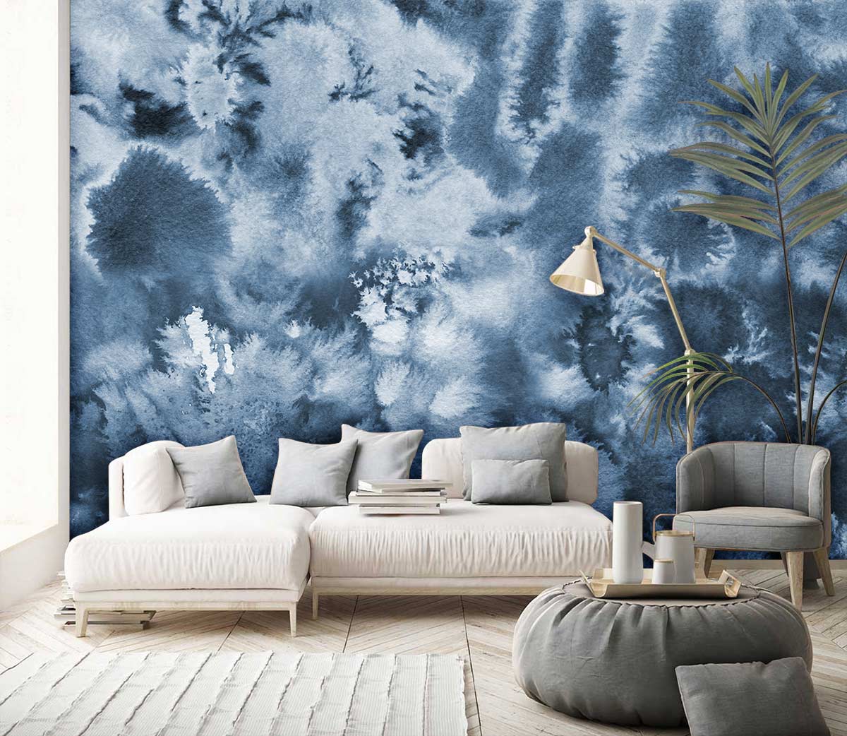 Serene Blue Watercolour Abstract Wallpaper in modern living room with white sofa, wooden flooring, grey pouffe.