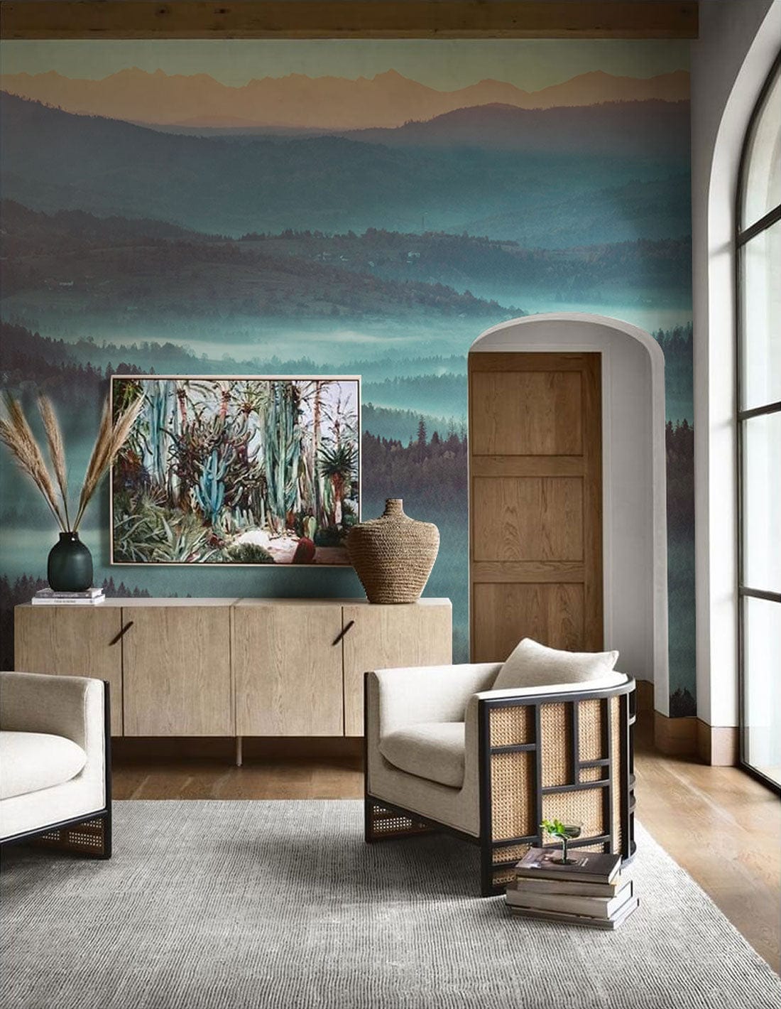 Tranquil Misty Hills Scenic Landscape Mural Wallpaper, serene blue tones, living room, neutral chairs.