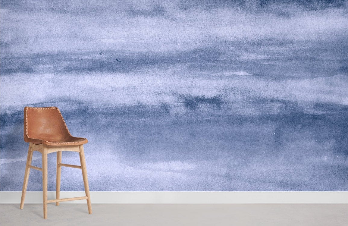 Serene Blue Watercolour Sky Mural Wallpaper in elegant room with a stylish brown leather chair.