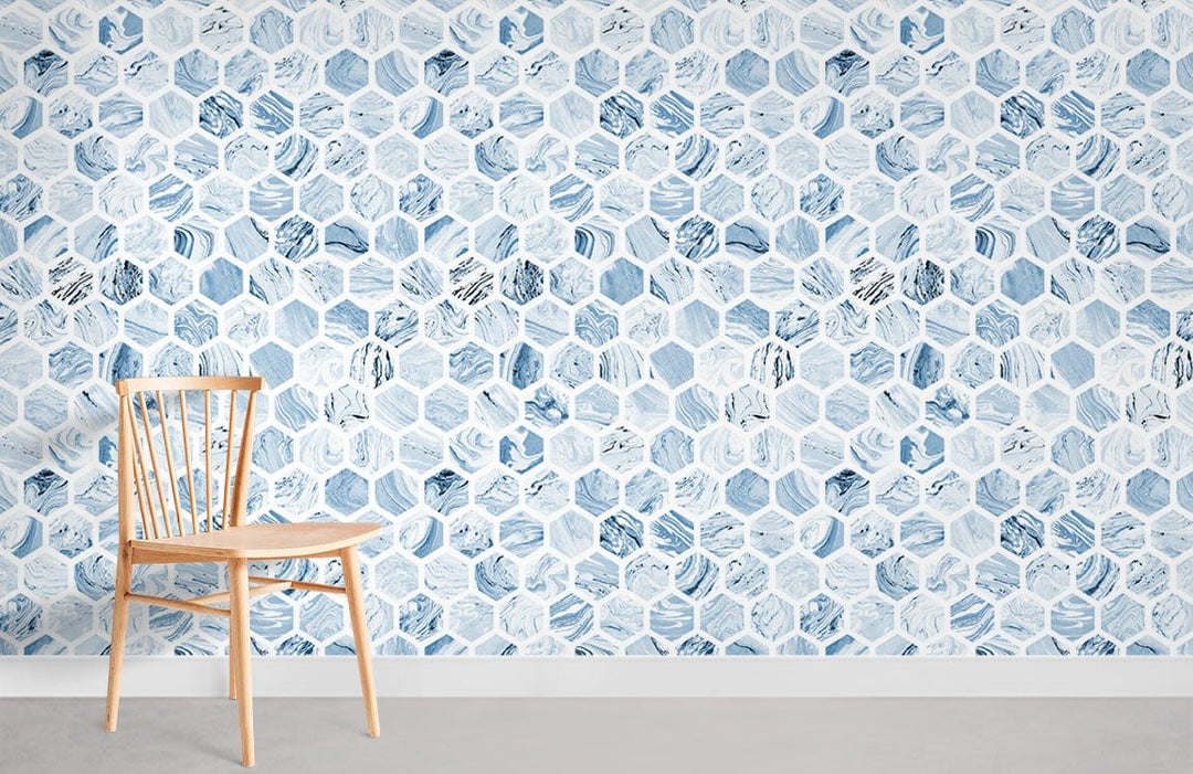 Elegant blue hexagonal wallpaper with beige wooden chair on grey flooring, modern geometric interior design.
