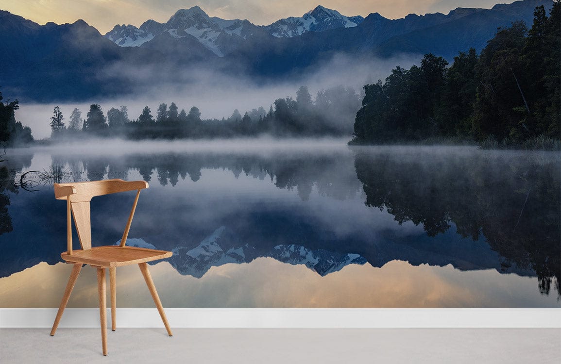 Chair against Tranquil Mountain Lake Reflection mural wallpaper; serene blue tones; wooden flooring.