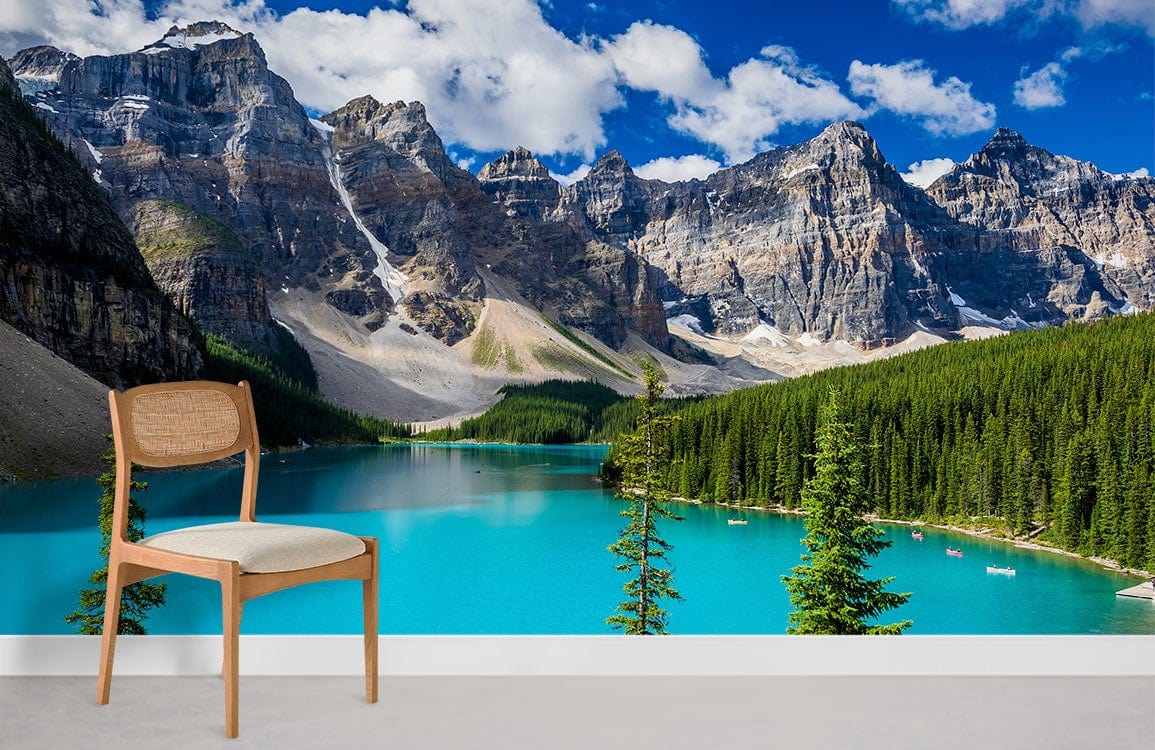 Serene Turquoise Mountain Lake mural wallpaper in minimalist room with wooden chair, grey flooring.