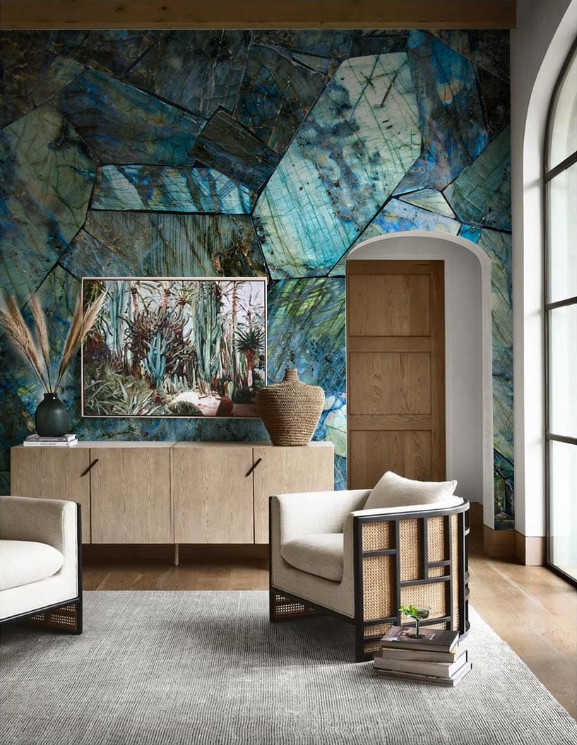 Iridescent blue gemstone wallpaper in living room with beige chairs, wooden sideboard, grey rug flooring.