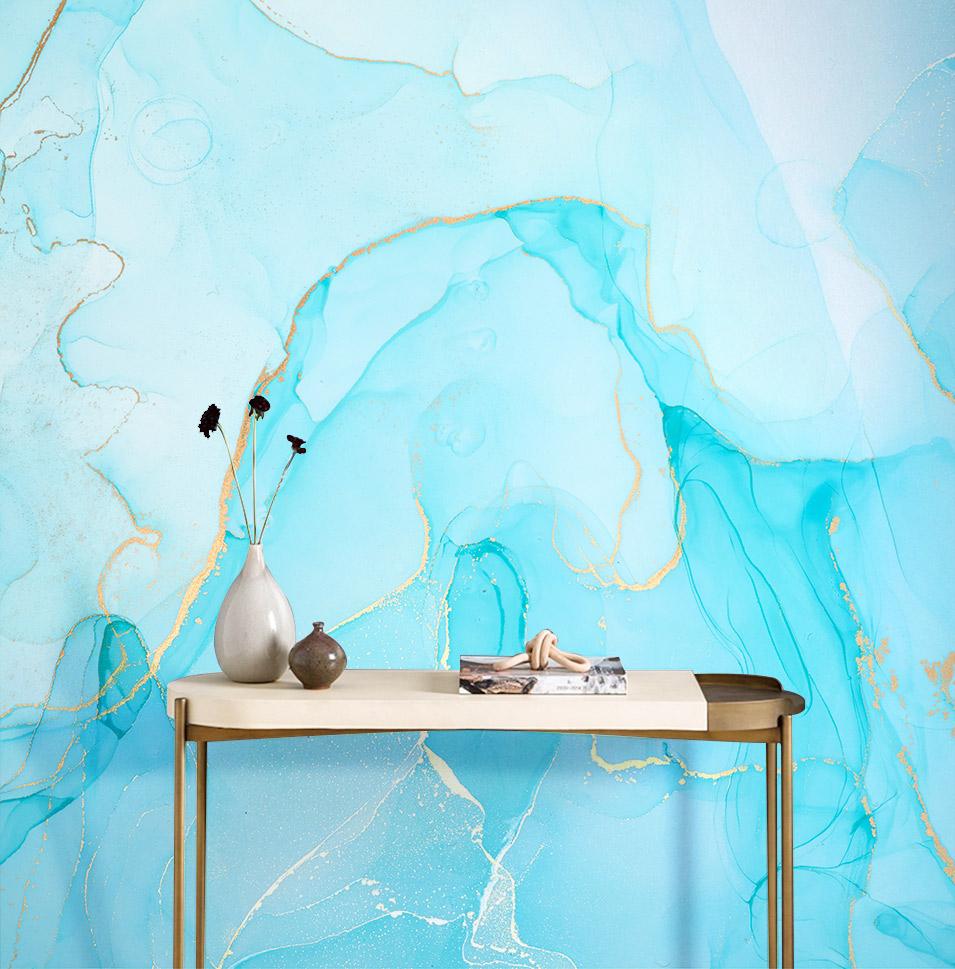 Turquoise marble mural wallpaper with gold accents behind modern console table, abstract wall design.