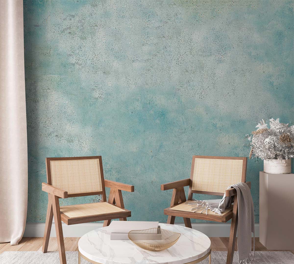 Vintage blue textured mural wallpaper, distressed aqua decor, with wooden chairs, round marble table, curtain.
