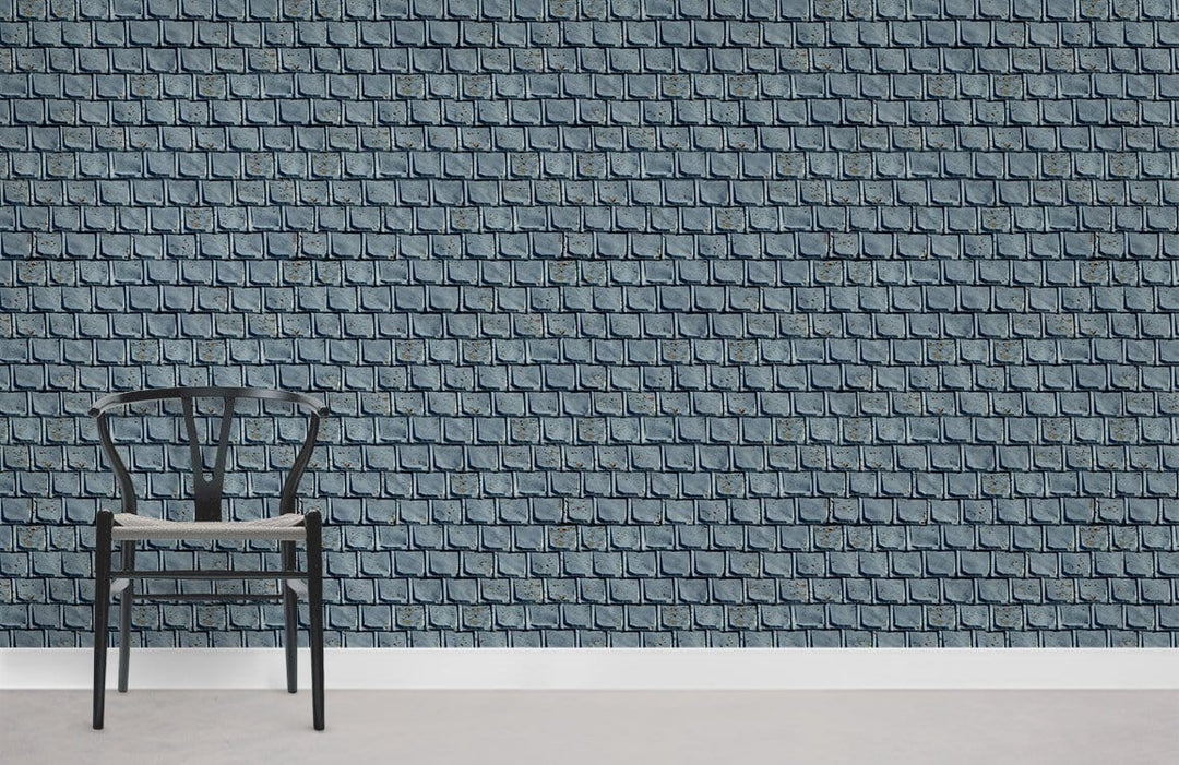 Grey rustic brick wallpaper in room with black chair, concrete flooring, vintage style Décor.