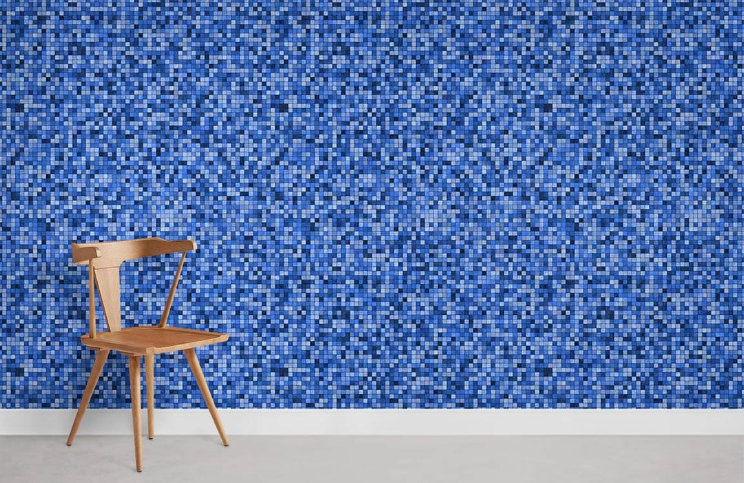 Modern blue pixelated mosaic wallpaper in contemporary interior with wooden chair, white skirting board.