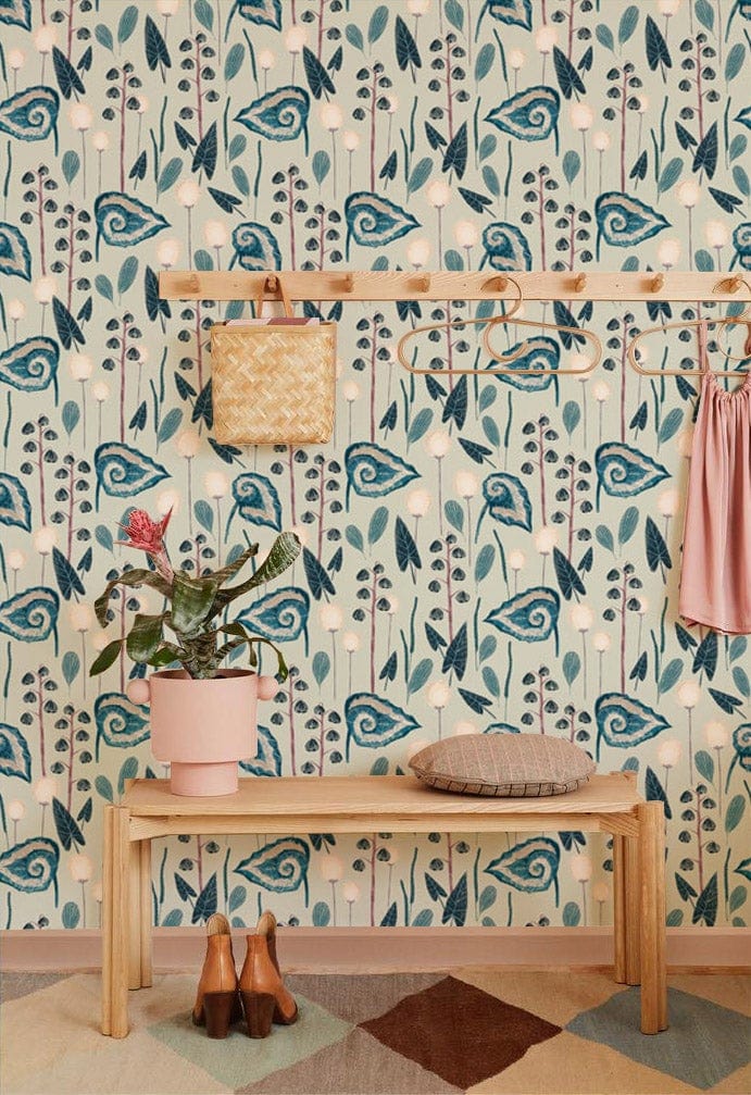 Vintage blue floral pattern wallpaper with wooden bench, coat rack, and diamond-patterned rug.