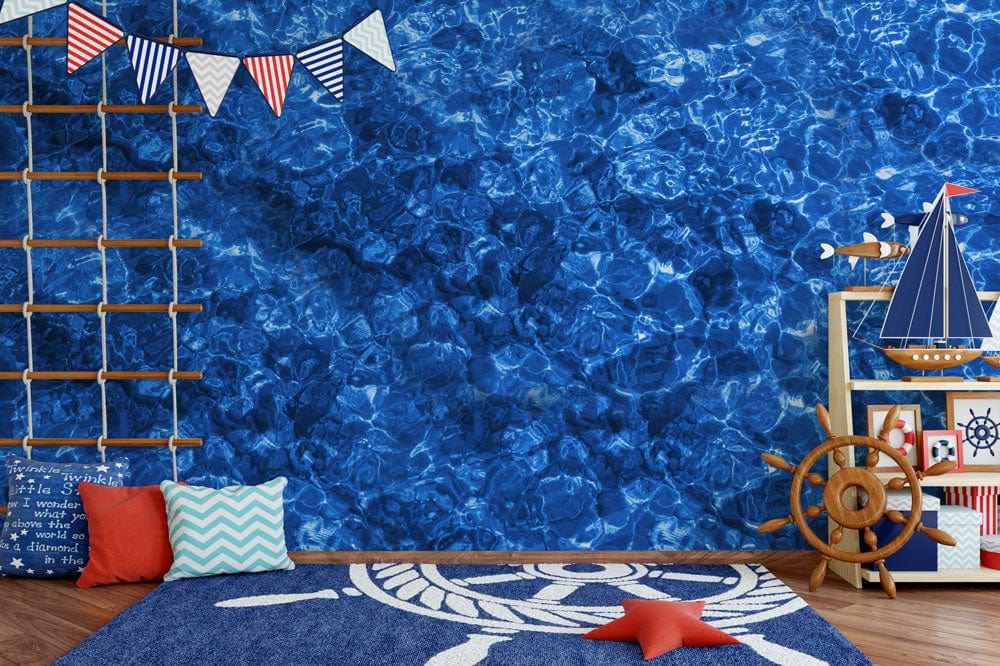 Deep Blue Ocean Water Ripple Effect Mural in nautical-themed room with wooden floor and decor.