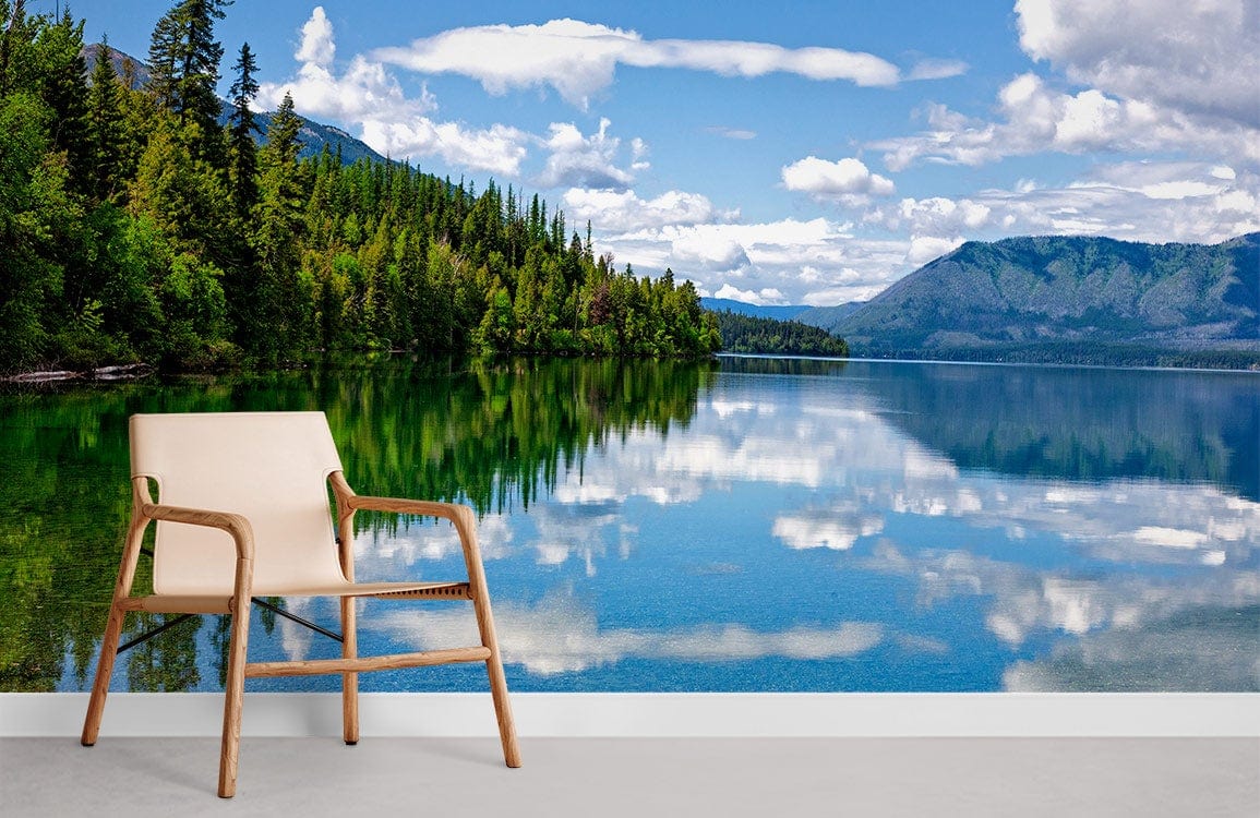 Tranquil Forest Lake mural with beige chair, blue sky, and serene lake reflection in modern room.