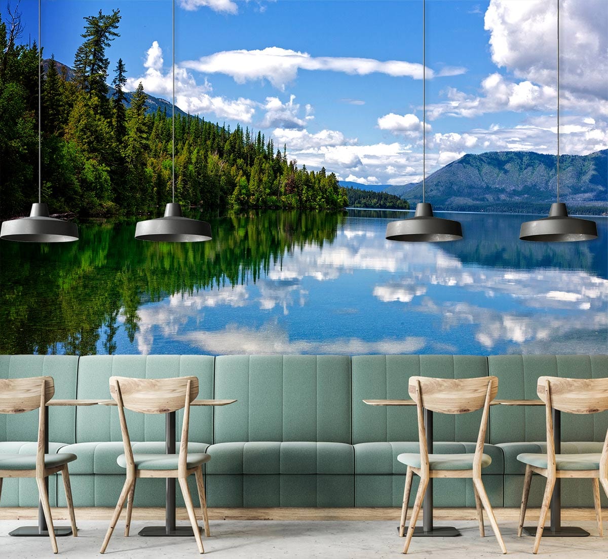 Green and blue landscape mural wallpaper featuring a serene lake; restaurant setting with wooden chairs.