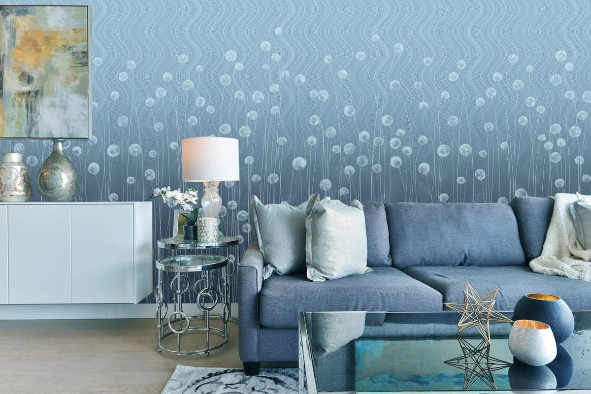 Elegant grey wavy floral wallpaper decor in modern living room with blue sofa and glass table.
