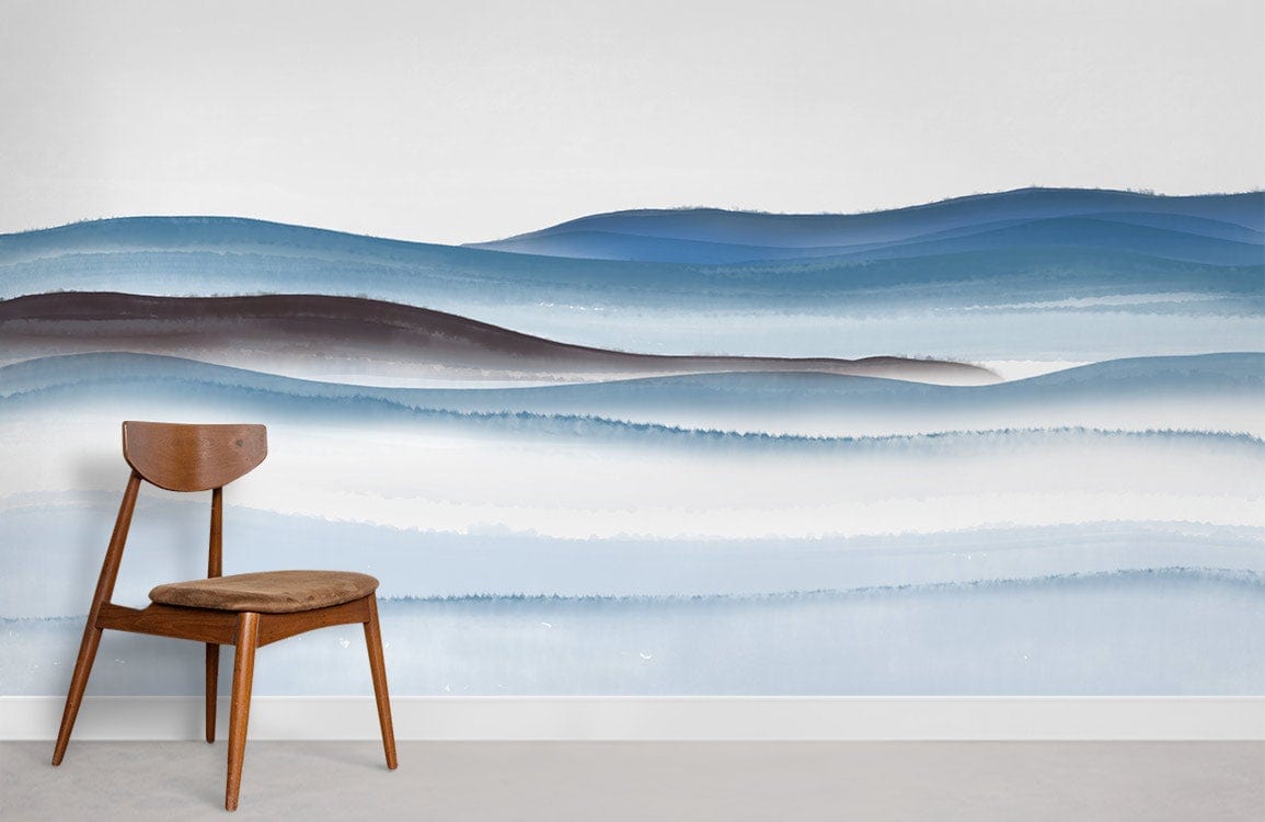 Tranquil Blue Watercolour Horizon Mural Wallpaper in serene room with wooden chair and grey flooring.